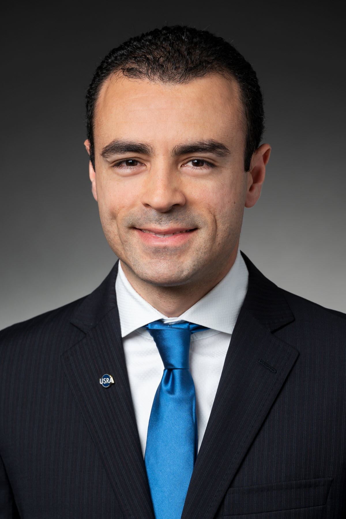 Dr. Miguel Román headshot